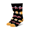 Pair of black crew socks with a repeating pattern of Hostess Twinkies; yellow sponge cakes with white cream filling.