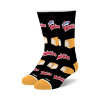Pair of black crew socks with a repeating pattern of Hostess Twinkies; yellow sponge cakes with white cream filling.