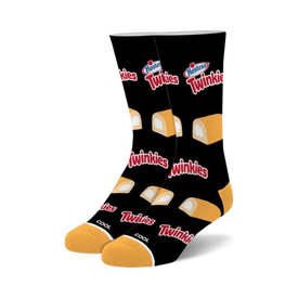 black crew socks with allover twinkie snack cake pattern. unisex style.  