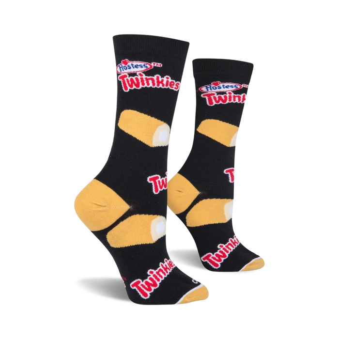 A black sock with a Hostess Twinkie pattern. The pattern features a yellow Twinkie on the lower left side of the sock and a red and white Hostess Twinkies logo on the upper right.