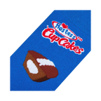 Close-up detail shot of Hostess Cupcakes sock highlighting the Hostess logo and cupcake graphic.