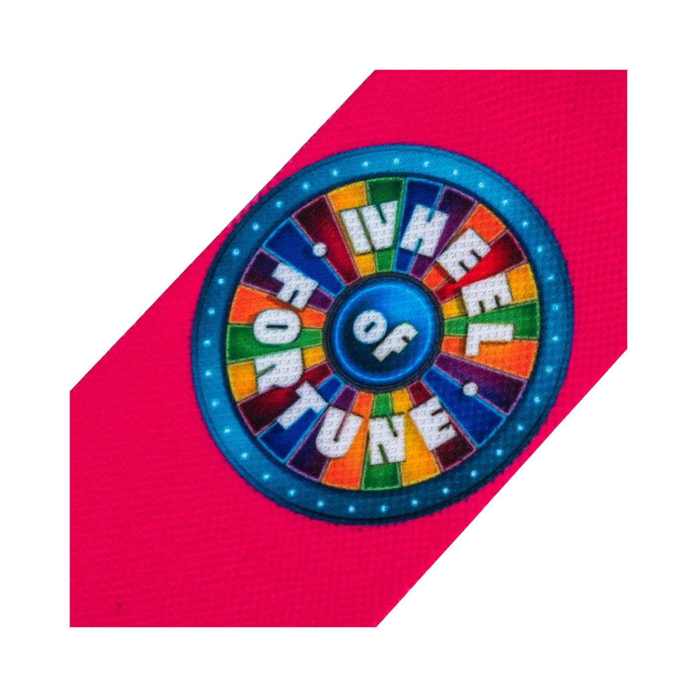Close-up detail shot of the Wheel of Fortune logo on the pink section of the sock.