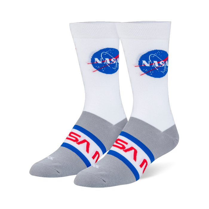 White and heather grey crew socks with the blue NASA meatball logo on the calf and the red NASA worm logo across the foot.