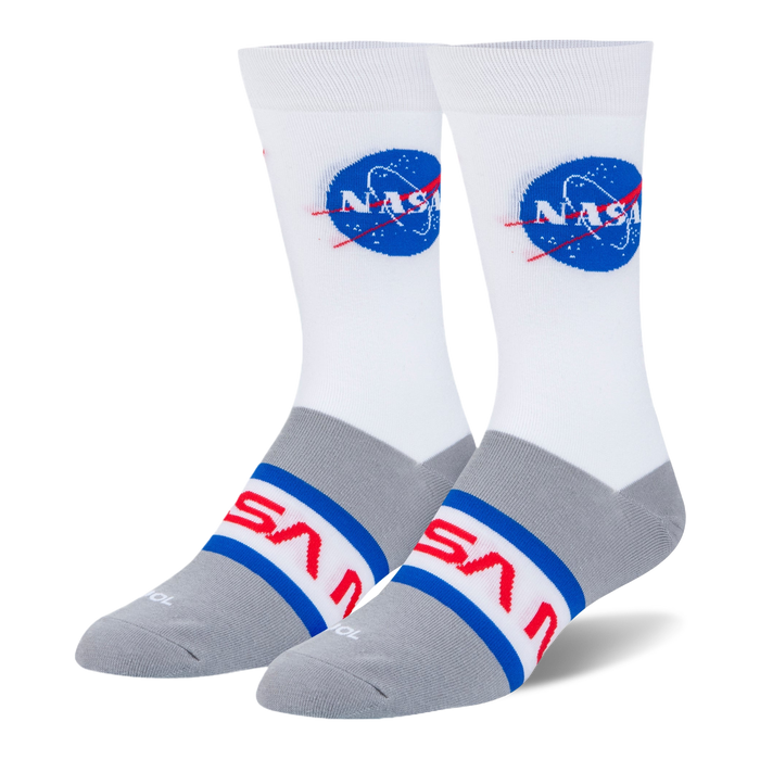 White and heather grey crew socks with the blue NASA meatball logo on the calf and the red NASA worm logo across the foot.
