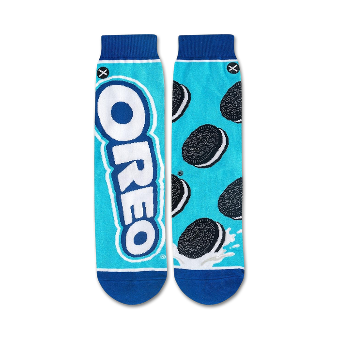 A person is sitting on a grocery store shelf with a box of Oreo cereal. The person is wearing white pants, gray sneakers, and socks with cartoon eyes on them.