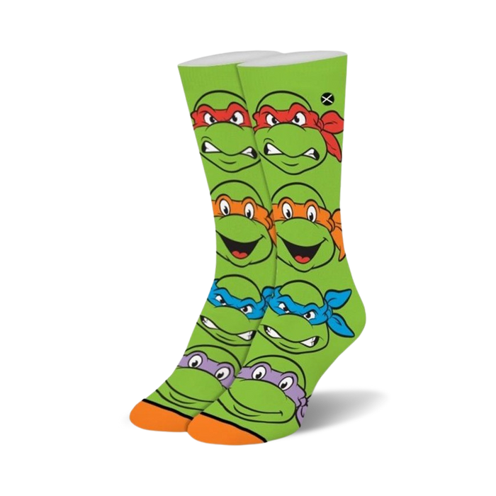 green crew socks with faces of teenage mutant ninja turtles. cotton blend material. ribbed cuff.   }}