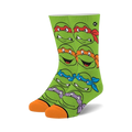 Crew socks in bright green featuring the faces of all four Teenage Mutant Ninja Turtles. Orange and purple accents around the turtle's mask.
