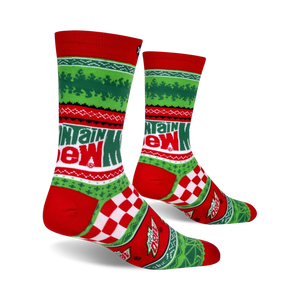 A pair of red and green socks with a pattern of snowflakes and the words 