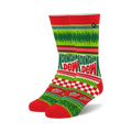 Crew socks in red, green, and white featuring a Mountain Dew Ugly Sweater design.  The socks showcase a checkerboard pattern, festive imagery, and the Mountain Dew logo.
