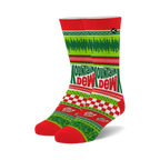 Crew socks in red, green, and white featuring a Mountain Dew Ugly Sweater design.  The socks showcase a checkerboard pattern, festive imagery, and the Mountain Dew logo.