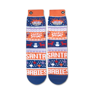 A pair of blue and orange socks with a pattern of Rugrats characters, candy canes, and snowflakes. The words 
