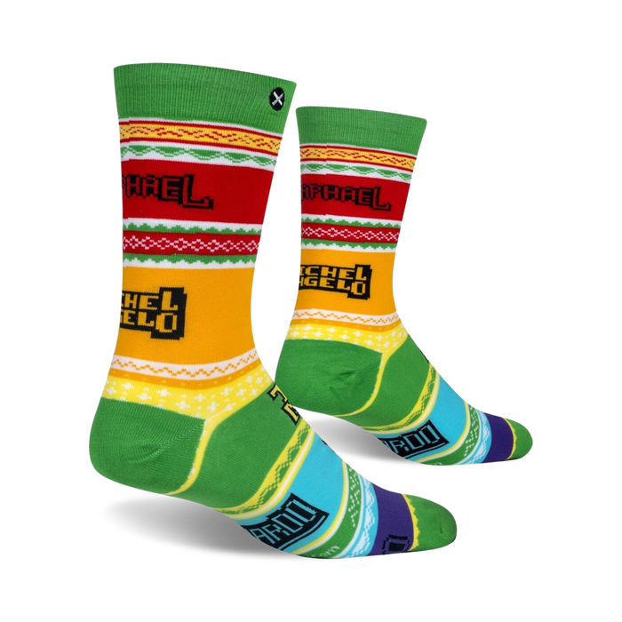 A red, green, and yellow striped sock with 8-bit pixelated images of the Teenage Mutant Ninja Turtles.