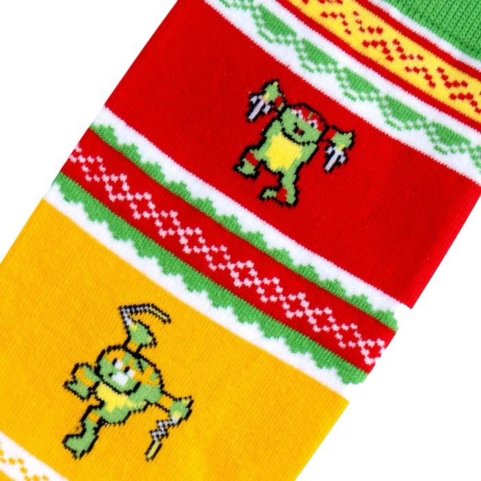 A red, green, and yellow striped sock with 8-bit pixelated images of the Teenage Mutant Ninja Turtles.