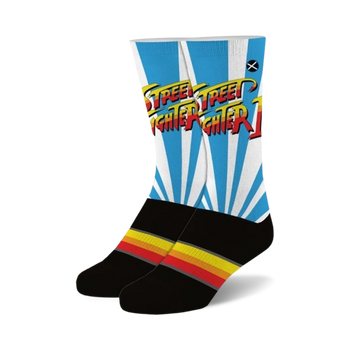 gaming apparel with street fighter 2 logo on the front. ken's iconic pop art logo in yellow, red and orange on a black and petrol dress athletic sock. novelty sock perfect for the street fighter fan in your life.   