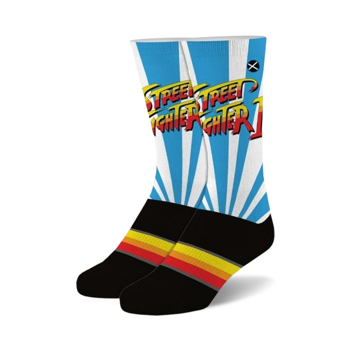 gaming apparel with street fighter 2 logo on the front. ken's iconic pop art logo in yellow, red and orange on a black and petrol dress athletic sock. novelty sock perfect for the street fighter fan in your life.    }}