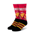 Pair of crew socks showcasing a Cheez-It box design.  Red, black, and yellow are the main colors. Features black stripes on the cuff.