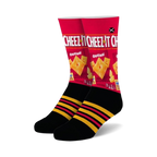 Pair of crew socks showcasing a Cheez-It box design.  Red, black, and yellow are the main colors. Features black stripes on the cuff.