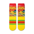 Close-up view of a pair of Honey Smacks socks, showcasing the cereal box design and yellow stripes.