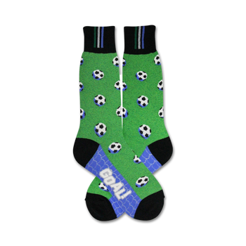green crew socks with black and white soccer ball pattern, black heel and toe, and word goal on sole; mens.  