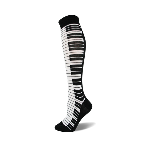 Knee-high socks in black and white, featuring a piano key design down the side.  A fun and stylish accessory!