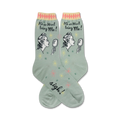 Pair of women's crew socks in sage green.  Features a retro illustration of a woman looking in a mirror and the text 'It's so hard being me!'