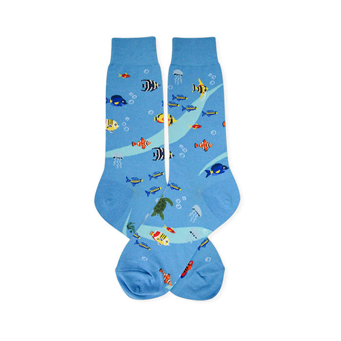 Light blue crew socks featuring a pattern of clownfish, sea turtles, jellyfish, blue tangs, and white bubbles. }}