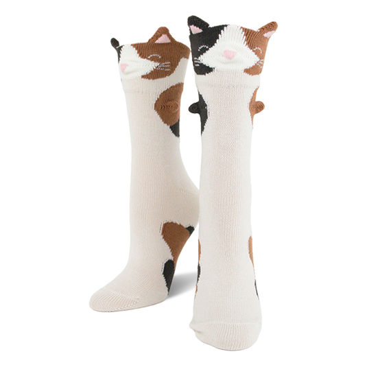 Pair of creamy white crew socks featuring calico cat faces with 3D ears and brown and black patches down the leg. }}