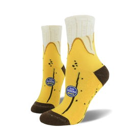yellow crew socks with brown toe and heel. non-skid soles. banana pattern in black and brown.  