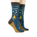 Pair of 'Let's Have S'more Fun!' socks on a model's feet against a black background.