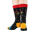 Pair of Sputnik socks on a model's feet, showcasing the back design and red cuff.