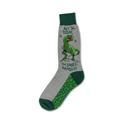 gray socks with green toes, heels, and cuffs featuring a t-rex dinosaur standing on its hind legs with its arms raised, surrounded by the words "not today, i'm short-handed!"  