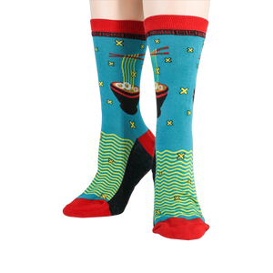 Flat lay showing both socks next to each other; highlighting the detail of the design and colors.