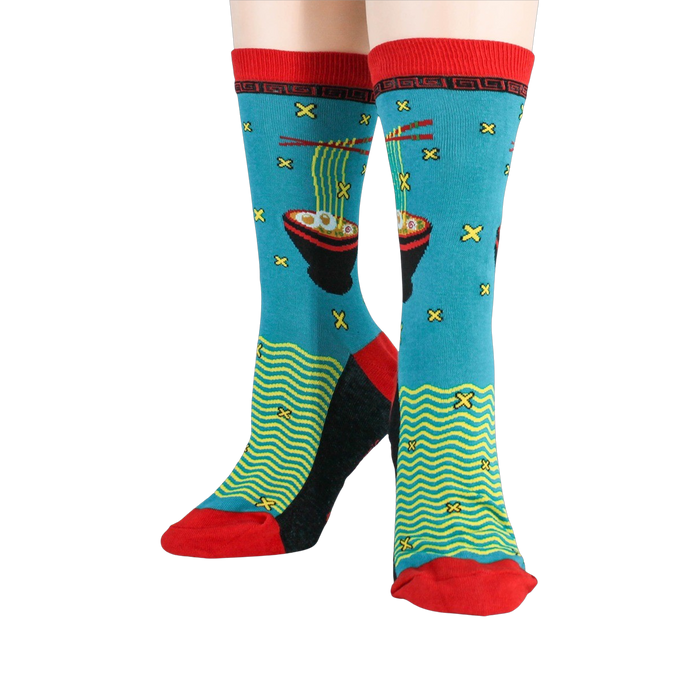 Flat lay showing both socks next to each other; highlighting the detail of the design and colors.