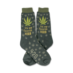 Crew socks in dark green with a repeating marijuana leaf pattern.  'It's my favorite herb' and '420' are featured on the socks.