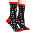 Pair of 'Dancing Notes' socks on a model's feet, showcasing the full design.