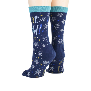 A pair of blue socks with a snowflake pattern and the words 