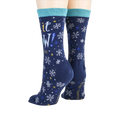 Close-up showcasing the back of the 'Let It Snow' socks, highlighting the design details.