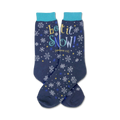 Pair of navy blue crew socks with a snowflake and star pattern and the text 'Let It Snow!' in yellow, blue, and white.