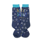 Pair of navy blue crew socks with a snowflake and star pattern and the text 'Let It Snow!' in yellow, blue, and white.