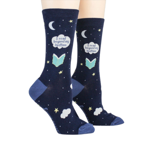 Lifestyle shot showing the socks on a person's feet.  The socks are navy blue with a whimsical design.