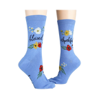 Another lifestyle shot showcasing the 'Blessed' socks; these are light blue with the words 'blessed' and 'thankful' on them.
