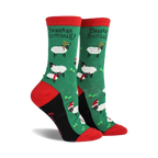 Pair of women's crew socks. Green background with festive sheep wearing Santa hats and scarves. Red and black accents.