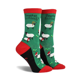 green socks with cartoon sheep wearing santa hats and scarves, 'baa baa humbug!' text.  