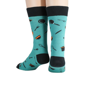 A pair of teal socks with the words 