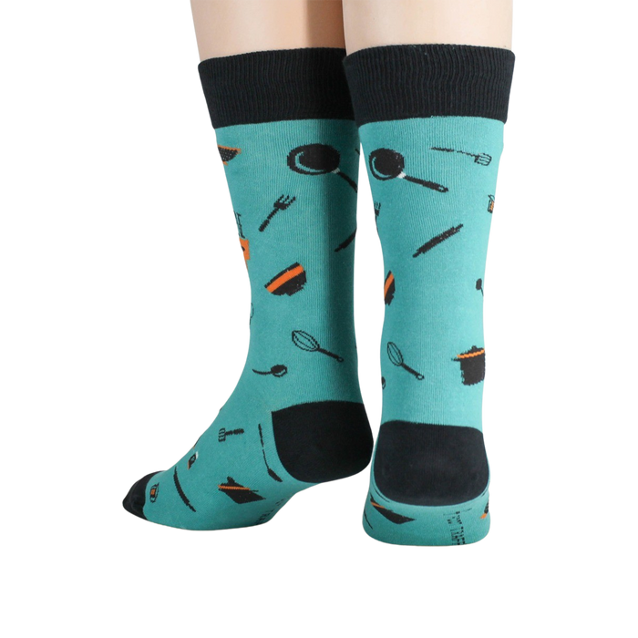 A pair of teal socks with the words 