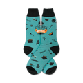 Pair of teal crew socks with black cuffs.  Features orange text 'My Kitchen My Rules' and small kitchen utensil icons.