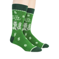 Lifestyle shot of a person wearing a pair of green 'Accountant' socks.