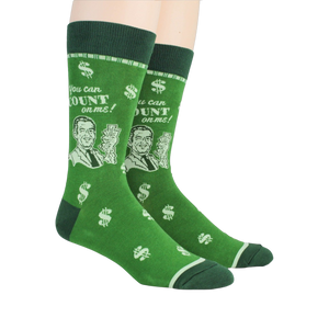 Lifestyle shot of a person wearing a pair of green 'Accountant' socks.