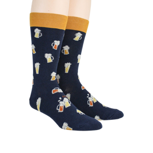 A pair of blue socks with a pattern of beer mugs on them. The top of the socks is yellow.