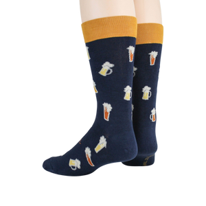 A pair of blue socks with a pattern of beer mugs on them. The top of the socks is yellow.
